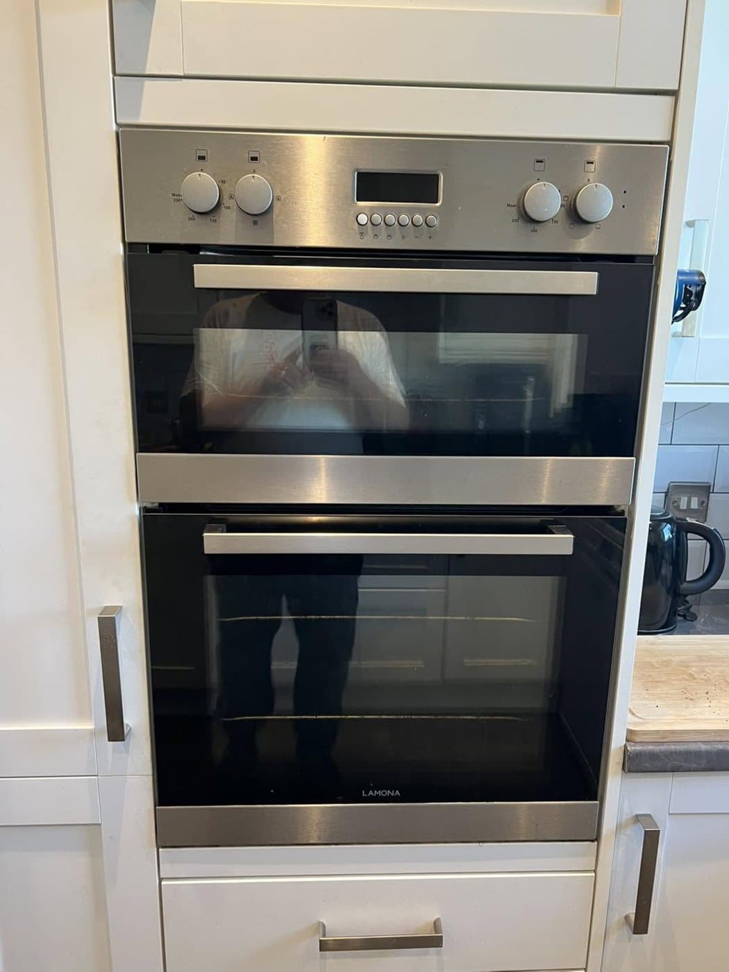 Integrated double oven installed in a fitted kitchen