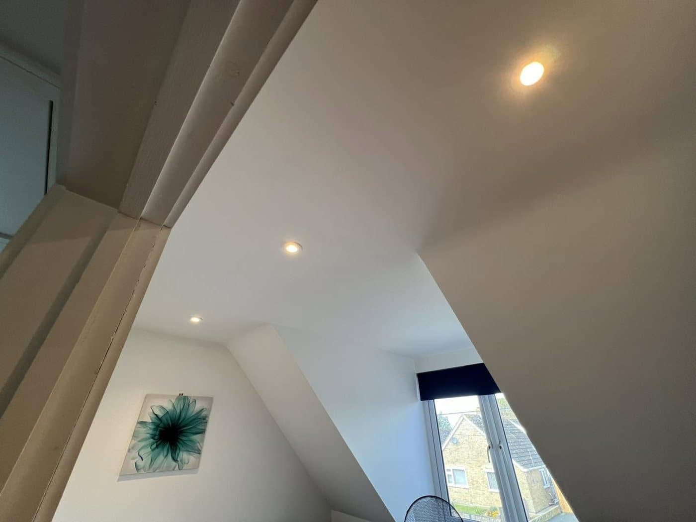 Recessed LED spotlights fitted into a vaulted ceiling